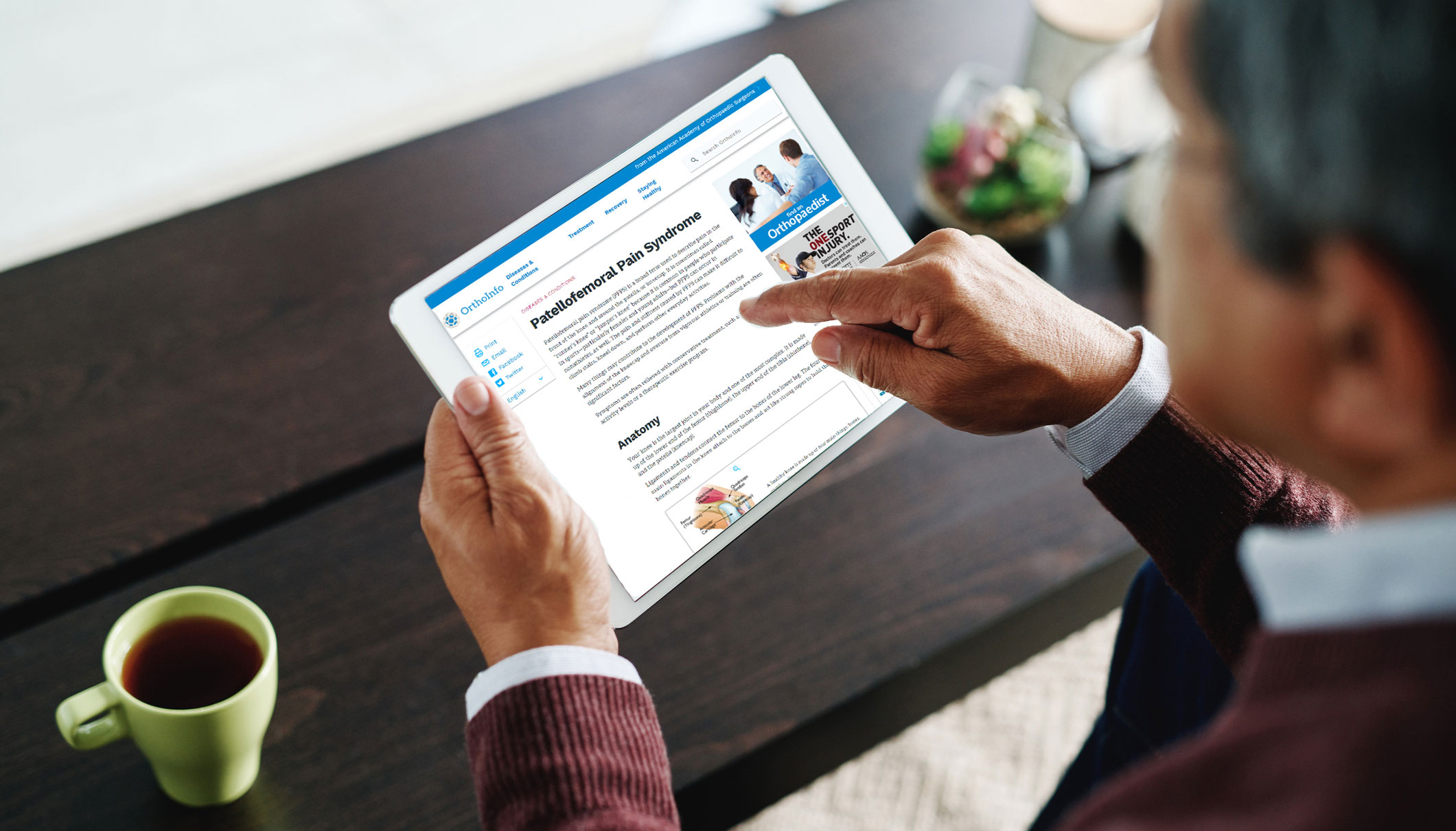 Older Man Browsing OrthoInfo Website on Tablet